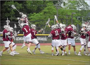  ?? PETE BANNAN — DIGITAL FIRST MEDIA ?? Conestoga players celebrate victory over Avon Grove in the District final at Henderson Thursday night.