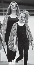  ?? Special to the Democrat-Gazette/JAMAL BURTON ?? A mom and daughter strut their stuff during the Mommy-N-Me segment of the inaugural Arkansas Kids Fashion Week, held last year in Conway. Arkansas Kids Fashion Week is also a yearround program that cultivates young people for the modeling and talent...
