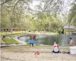  ?? PATRICK CONNOLLY/ORLANDO SENTINEL ?? Recreation­ists take in the cool waters of Juniper Springs in Ocala National Forest.