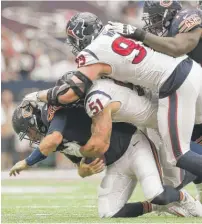  ?? | GETTY IMAGES ?? Jay Cutler ( shown being sacked by the Texans on Sept. 11) is 3- 3 when he returns after missing at least one start.