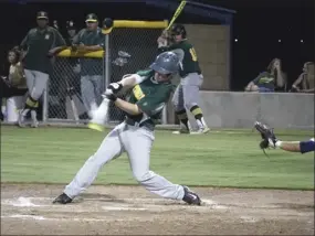  ?? KARINA LOPEZ PHOTO ?? Holtville High's Seth Hilfiker connects for a hit against Calipatria High.