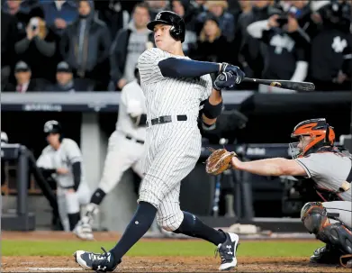  ?? (AP PHOTO/KATHY WILLENS) ?? New York Yankees’ Aaron Judge hits a three-run home run during the fourth inning of Game 3 of baseball’s American League Championsh­ip Series against the Houston Astros Monday in New York.