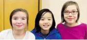  ??  ?? From left, Ella Hopkins-Bryan, 10, Maya Sano, 11, and Clara Austrins, 11, attended the film screening of Girl Rising at Library and Archives Canada.