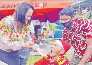  ?? Picture: RAMA ?? Minister for Women, Children and Poverty Alleviatio­n Rosy Akbar feeds one of the residents of Golden Age Home in Samabula during the Christmas party bash.