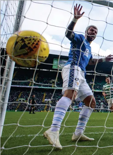  ??  ?? Scott Sinclair scores Celtic’s fourth goal – and his second of a hat-trick – but Oliver Burke (right) was taken off late with an ankle knock
