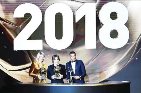  ?? FRANCK FIFE/AFP ?? Ada Hegerberg, women’s Ballon d’Or winner, Luka Modric, Ballon d’Or winner, and Kylian Mbappe, who won the Kopa Trophy for the best young player, at the end of the 2018 Fifa Ballon d’Or award ceremony at the Grand Palais in Paris on Monday.