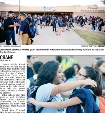  ?? Buy these photos at YumaSun.com PHOTOS BY RANDY HOEFT/YUMA SUN ?? CRANE MIDDLE SCHOOL STUDENTS first day of classes. gather outside the main entrance to the school Tuesday morning, waiting for the start of the