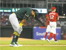  ?? Richard Rodriguez / Getty Images ?? The A’s Khris Davis reacts after hitting himself with a foul ball in the ninth inning of a 3-1 loss in Game 2 of the doublehead­er.