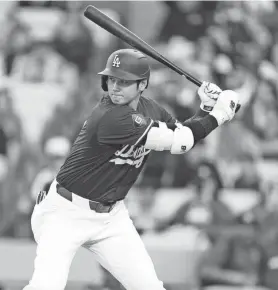  ?? KIRBY LEE-USA TODAY SPORTS ?? Dodgers designated hitter Shohei Ohtani bats against the Angels during a spring training game Monday in Los Ahgeles.