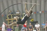  ?? The Sentinel-Record/James Leigh ?? GOING UP: Lake Hamilton graduate Haze Farmer goes up for one of his vaults Thursday during the Fourth of July Freedom Vault at Arkansas Vault Club in Black Springs. Farmer won the event with a final height of 17 feet.