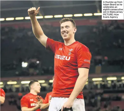  ??  ?? A thumbs-up from Adam Beard as he celebrates an eighth consecutiv­e win in Wales jersey PICTURE: Huw Evans Agency