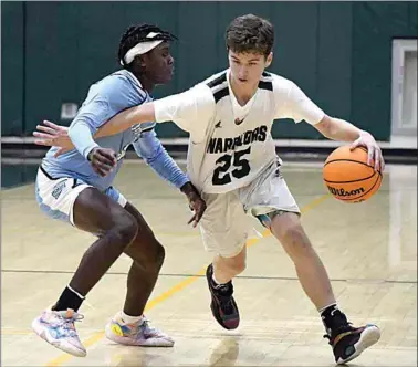  ?? PHOTO BY VICKY SHEA ?? Ryan Mitchell gets separation from his defender in the SYML opener against South last week. The Warriors narrowly lost to the Spartans, 72-71. Tehachapi also had a victory in their first week of league play, defeating East 62-56.