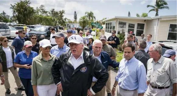  ?? DOUG MILLS/THE NEW YORK TIMES ?? U.S. President Donald Trump tours a mobile home park in Naples, Fla., Thursday, where he announced he is eager to protect undocument­ed young people brought to the U.S. illegally as children.