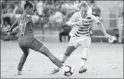  ?? Mike Comer Getty Images ?? SAMANTHA MEWIS of the U.S., right, defends Panama’s Aldrith Quintero during a recent game.