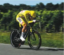  ?? Philippe Lopez / AFP via Getty Images ?? Tadej Pogacar maintained a lead of more than five minutes after the final time trial, and there remains but one stage.