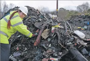  ?? Photograph Iain Ferguson, The Write Image. IF F06 SEPA FLY TIPPING 01 ?? Kath MacDowall of SEPA sorts through the untidy mess of fly-tipped rubbish at Camghael, near Fort William, last week.