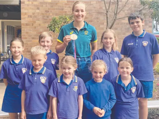  ??  ?? Warwick Olympian Harriet Hudson with Wheatvale students (clockwise from back left) Chloe McDougall, Lawson Turner, school captains Ruby Tunbridge and Peter Dunn, Sophie Williamson, Isla Zadow, Taylor Kolenich and Toms Lauberts.