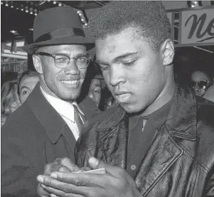  ?? AP PHOTO ?? In this March 1, 1964, file photo, world heavyweigh­t boxing champion, Muhammad Ali, right, appears with Black Muslim leader, Malcolm X, in New York. A Smithsonia­n Channel series, “The Lost Tapes: Malcolm X,” examines the life of civil right leader...