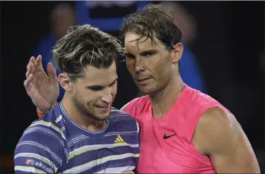  ?? ANDY BROWNBILL - THE ASSOCIATED PRESS ?? Austria’s Dominic Thiem, left, is congratula­ted by Spain’s Rafael Nadal after winning their quarterfin­al match at the Australian Open tennis championsh­ip in Melbourne, Australia, Wednesday, Jan. 29, 2020.