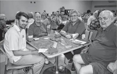  ?? ELIZABETH PATTERSON/CAPE BRETON POST ?? (ABOVE) Duplicate bridge players from all over North America are in Sydney this weekend to play in a sectional bridge tournament including these four from or with roots in Florida. From left, Chuck Bucknell, 20, from Naples, Florida and the youngest person in the tournament; Doug Walters from New Glasgow and Clearwater, Florida; Andrew Bucknell from Naples, Florida and father to Chuck Bucknell; and Doug Roberts, originally from Glace Bay but now from New Glasgow and Clearwater, Florida.