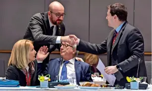  ?? AP ?? European Commission president Jean-Claude Juncker (seated) Belgian Prime Minister Charles Michel and European Commission secretary-general Martin Selmayr during a breakfast meeting at an EU summit in Brussels on Friday. —