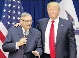  ?? Mary Altaffer Associated Press ?? PRESIDENT Trump’s pardoning of Sheriff Joe Arpaio of Arizona, left, was seen by some as “a test run for shutting down” the special counsel’s Russia inquiry.