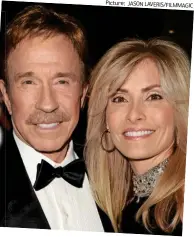  ?? Picture: JASON LAVERIS/FILMMAGIC ?? Agonising condition: Film star Chuck Norris and his wife Gena