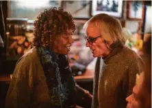  ?? Dennis Hearne 2014 ?? North Beach mainstay Tony Ryan visits with Cuban poet Nancy Morejón at Specs’ Twelve Adler Museum Cafe in 2014.