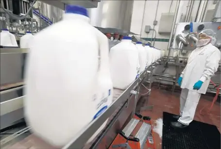  ?? Photograph­s by Luis Sinco Los Angeles Times ?? PRODUCTION at the Clover Sonoma dairy plant in Petaluma includes milk labeled as not containing geneticall­y modified organisms.