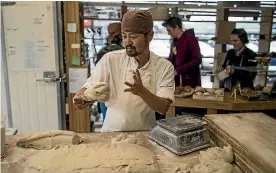  ?? PHOTO: IAIN MCGREGOR/ STUFF ?? Lex Roh is a baker at Bohemian Bakery in Sumner. He moved from Seoul, Korea, in 2015 in search of a better worklife balance. Spoiler alert: he found it.