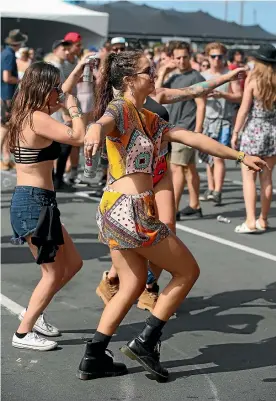  ??  ?? Fans dance during the one-day 2016 Laneway festival in Auckland. Helped by its Australian brand, it is close to reaching a 50/50 balance with acts.