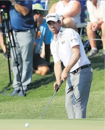  ?? SAM GREENWOOD/GETTY IMAGES ?? Webb Simpson plays a shot on the 16th hole during the second round of The Players Championsh­ip on the Stadium Course at TPC Sawgrass in Ponte Vedra Beach, Fla., Friday.