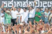  ?? REUTERS ?? Ranil Wickremesi­nghe (3rd left) waves at his supporters.