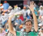  ?? Picture: AFP ?? UPPER HAND: Roger Federer holds the winner’s trophy after defeating Rafael Nadal