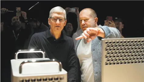  ?? Jeff Chiu / Associated Press ?? Apple CEO Tim Cook (left) with Jonathan Ive, chief design officer, who is leaving after more than two decades with the company.