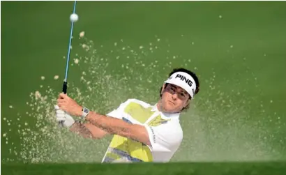  ?? AFP ?? Bubba Watson hits out of the bunkers on the second hole during the second round of the 2014 Masters in Augusta. —