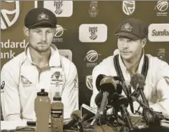  ?? AFP ?? Australia's captain Steve Smith (right) and teammate Cameron Bancroft at a press conference in Cape Town, March 24