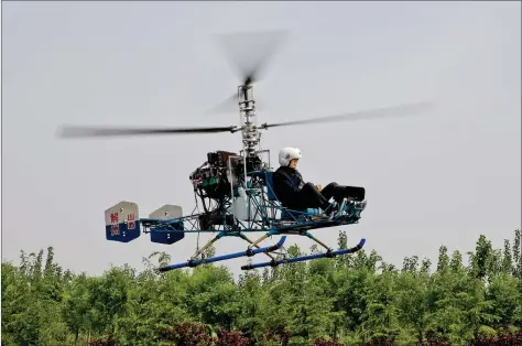  ?? REUTERS ?? Sixty-year-old villager Guo Leiting, flies his home-made helicopter in Yuncheng, Shanxi province, China on Thursday.