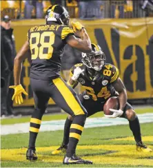  ?? Keith Srakocic / Associated Press ?? Steelers wide receiver Antonio Brown celebrates with Darrius Heyward-Bey after a touchdown reception.