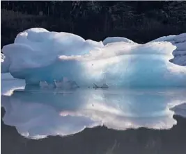  ?? RUTH FREMSON/THE NEW YORK TIMES 2019 ?? Icebergs that calved from a glacier float in Portage Lake near Anchorage, Alaska. Climate change is seen as a driver behind the breakage.