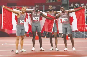  ?? ANDREJ ISAKOVIC/AFP VIA GETTY IMAGES FILES ?? Canada's Jerome Blake, second from left, joins Andre De Grasse, Brendon Rodney and Aaron Brown after winning bronze in the 4x100m relay at the Tokyo Summer Olympics.
