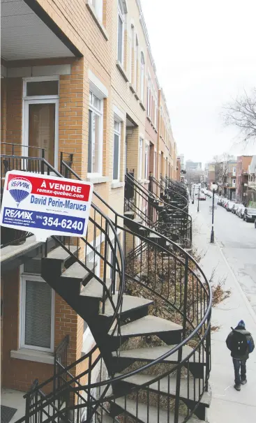  ?? CHRISTINNE MUSCHI / REUTERS ?? A “For Sale” sign is displayed in the Le Plateau Mont-royal borough of Montreal.