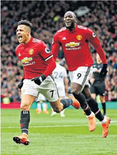  ??  ?? Hit men: Scorers Alexis Sanchez and Romelu Lukaku celebrate United’s second goal