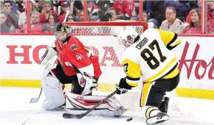  ?? — AFP ?? OTTAWA: Sidney Crosby #87 of the Pittsburgh Penguins takes a shot on Craig Anderson #41 of the Ottawa Senators during the second period in Game Four of the Eastern Conference Final during the 2017 NHL Stanley Cup Playoffs at Canadian Tire Centre.