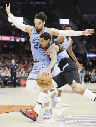  ??  ?? In this Dec 20, 2019 file photo, Cleveland Cavaliers’ Jordan Clarkson, (front right), drives past Grizzlies’ Dillon
Brooks (24) in the second half of an NBA basketball game in Cleveland. (AP)