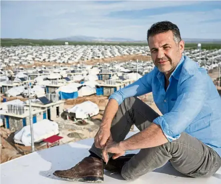  ?? — BRIAN-SOKOL/UNHCR ?? Hoesseni at a refugee camp. The author of the bestsellin­g Kite Runner has released his first picture book addressing the plight of refugees, Sea Prayer.