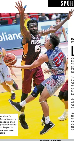  ?? —AUGUST DELA CRUZ ?? Arellano’s Rence Alcoriza scoops a shot past Prince Eze of Perpetual.