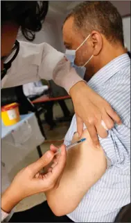  ?? (AP/Abdeljalil Bounhar) ?? A man receives a third dose of the Pfizer covid-19 vaccine Monday in Casablanca, Morocco.