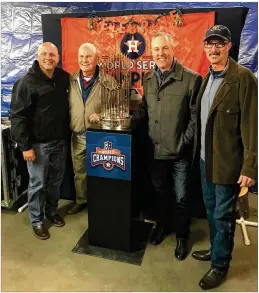  ?? CONTRIBUTE­D / ROUND ROCK EXPRESS ?? Reid Ryan (second from right) joins former Express bench coach Spike Owen, former manager Jackie Moore and former pitching coach Mike Maddux with the Astros’ world championsh­ip trophy.