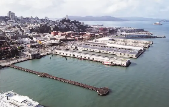  ?? Santiago Mejia / The Chronicle ?? Several piers with dilapidate­d buildings along the northern end of the Embarcader­o are among those the Port of San Francisco would like to see revived.